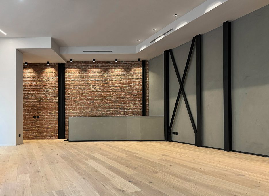 loft mattoni ferro parquet cemento